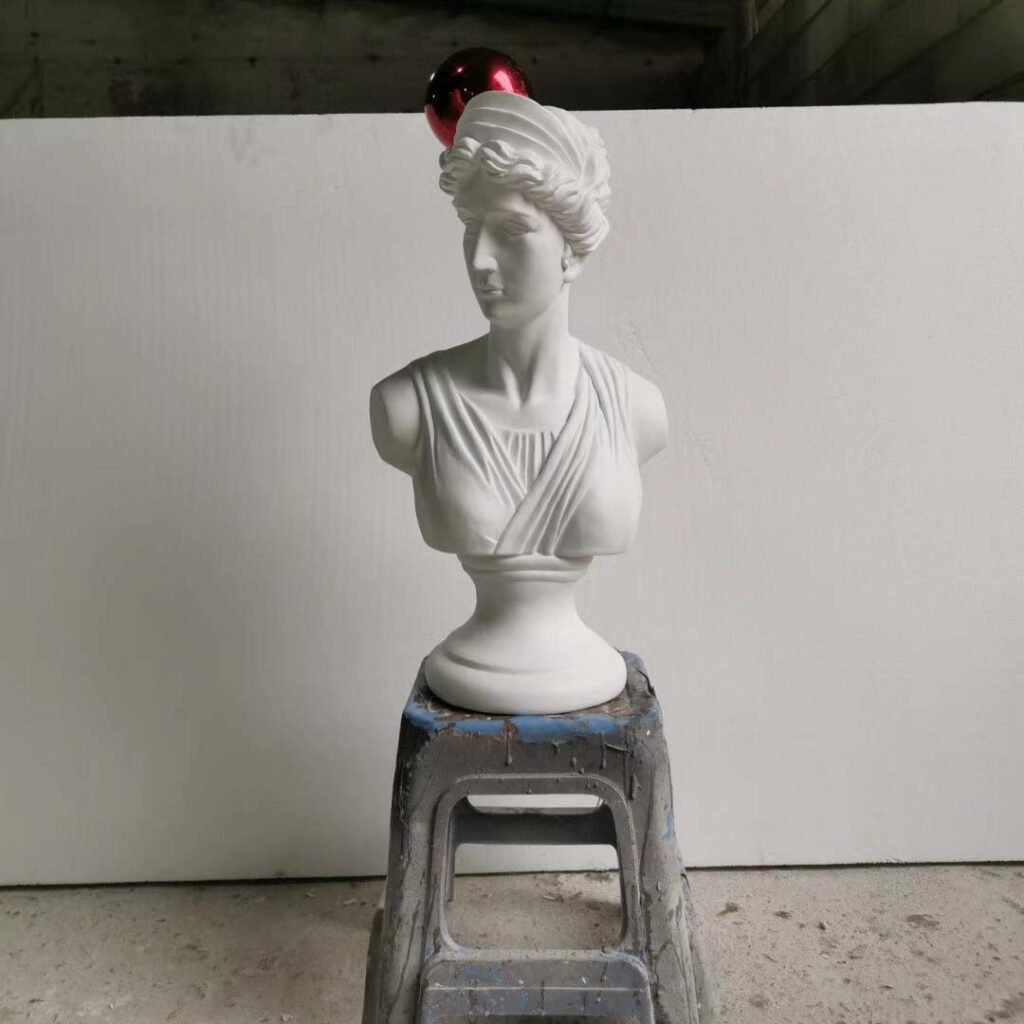 statue sculpture stand glass table
